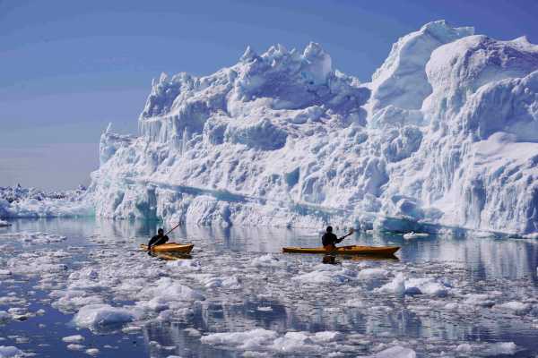 Kayak among Icebergs