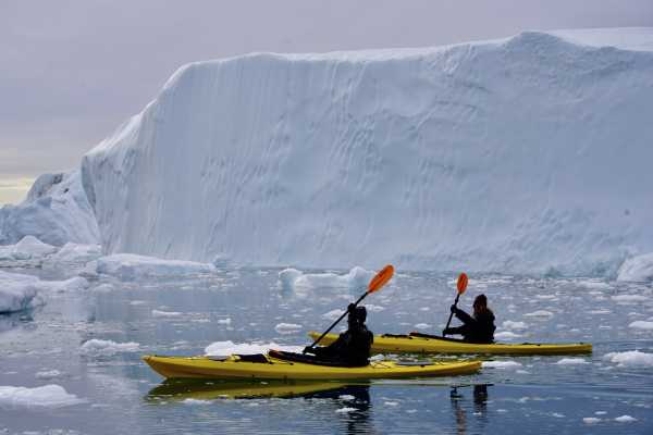 Kayak among Icebergs