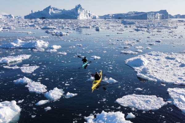 Kayak among Icebergs