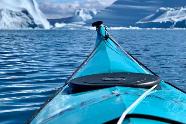 Kayak among Icebergs