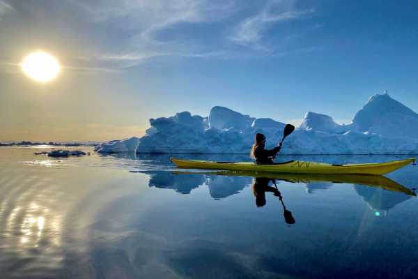 Kayak among Icebergs