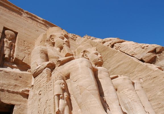 close up of statues at abu simble and blue sky aswan egypt