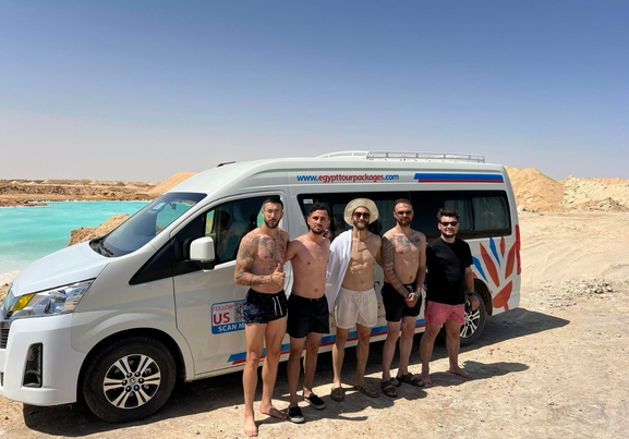 group of friends and car transfer at siwa salt lake