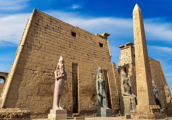 Temple of luxor status and Obelisk wihe blue sky and sunny day 