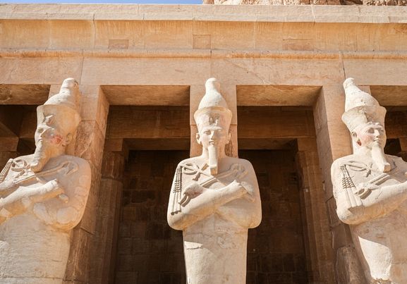 Ancient Egyptian Statues at Mortuary Temple luxor egypt 