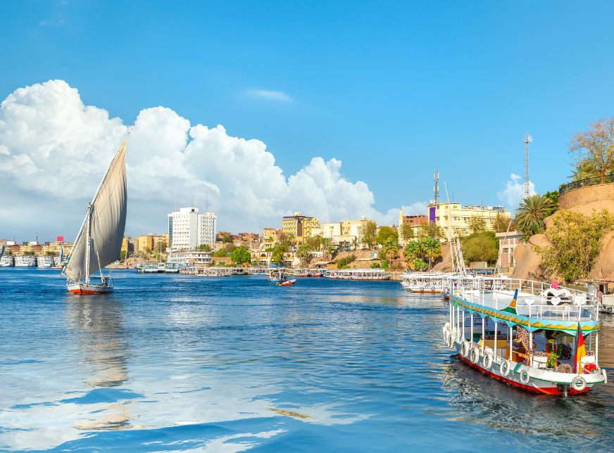Traditional felucca sailing on the Nile River in Aswan Egypt