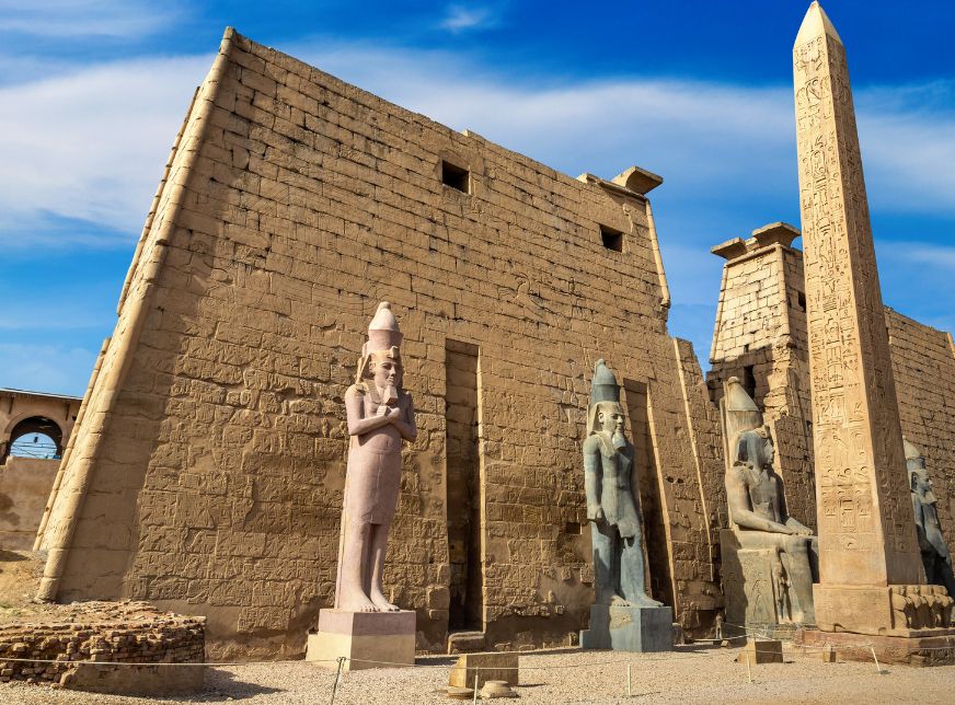 Entrance to egyptian Luxor Temple and blue cloudy sky-luxor-egypt