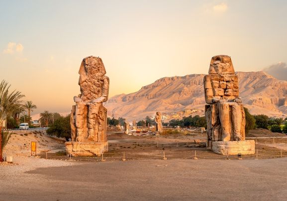 The Colossi of Memnon- two massive stone statues of Pharaoh Amenhotep Luxor Egypt.