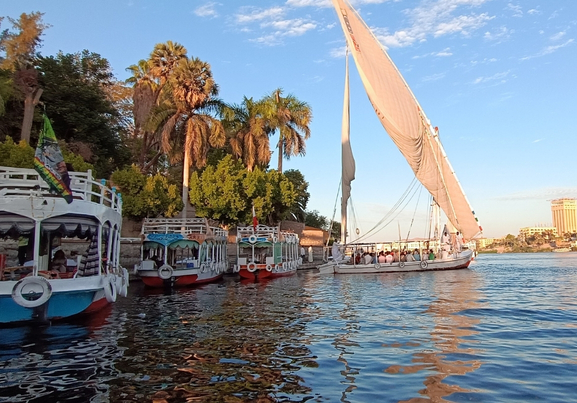sunny day Nile river boat cruising through Luxor  Nile River aswan egypt 