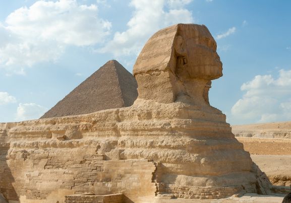 The Great Sphinx and the Pyramids of Giza and the desert landscape Egypt