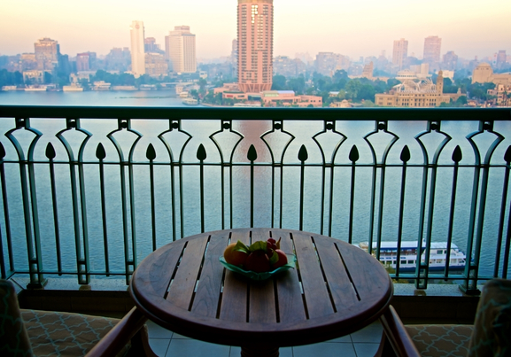 Aerial View Of Nile River With Cityscape On Balcony With Table And Chairs In Morning In Cairo In Egypt
